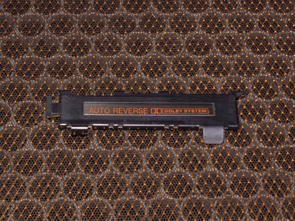 86-88 Mazda RX7 OEM Radio Cassette Player Flapper Door