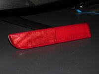 08-15 Mitsubishi Lancer EVO OEM Rear Bumper Light Reflector Lens - Left