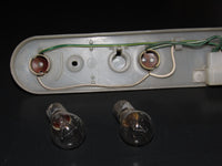 73 74 Toyota Celica ST Coupe OEM Tail Light Bulb Socket Panel - Left