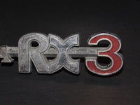 72-78 Mazda RX3 OEM Rear Quarter Panel Emblem Badge